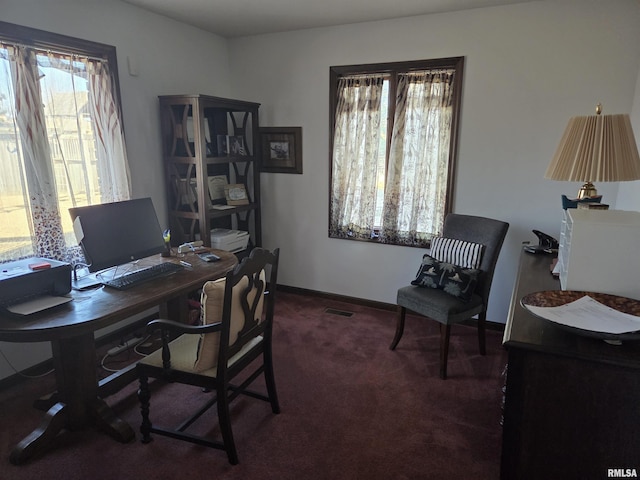 carpeted office space with baseboards