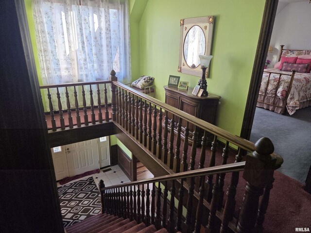 carpeted bedroom featuring baseboards