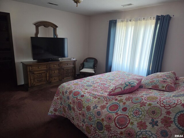 bedroom with carpet and a ceiling fan