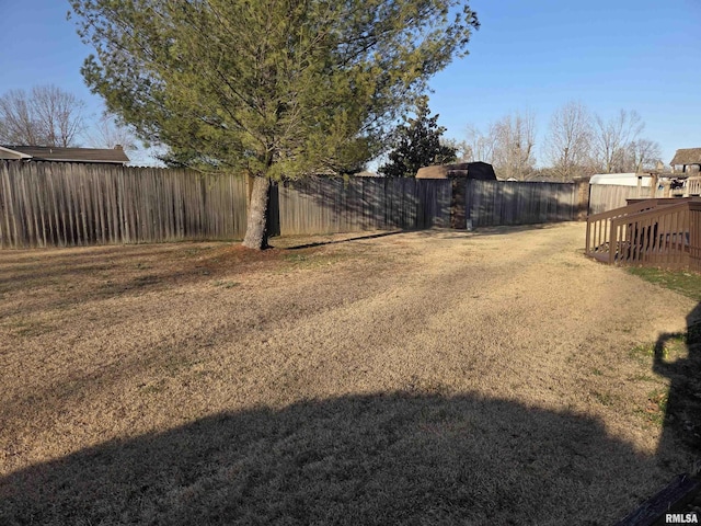 view of yard with a fenced backyard