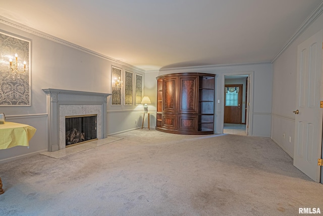 unfurnished living room featuring carpet flooring, a high end fireplace, and crown molding