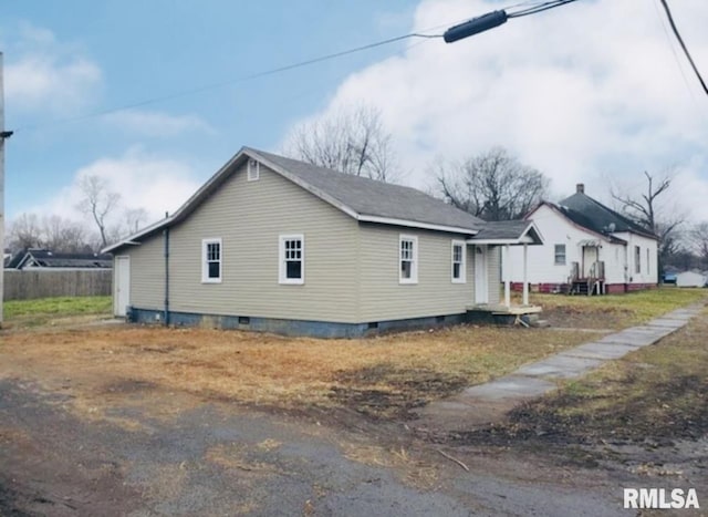 view of property exterior featuring crawl space