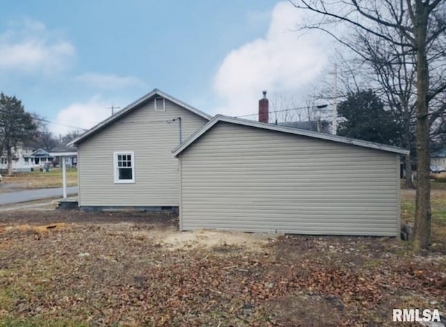 view of home's exterior featuring a chimney