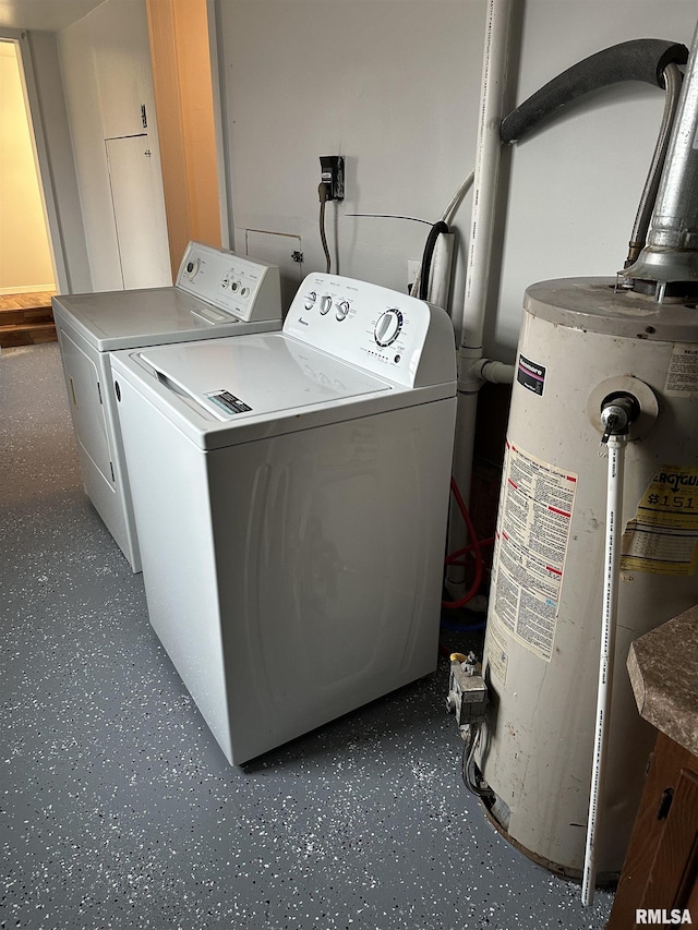 laundry area featuring gas water heater, laundry area, and washer and clothes dryer