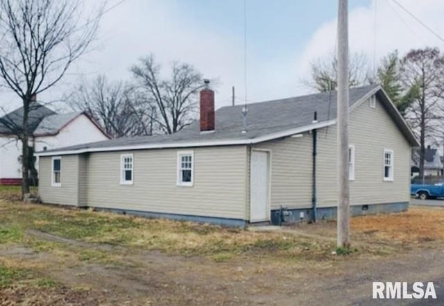 back of property featuring a chimney