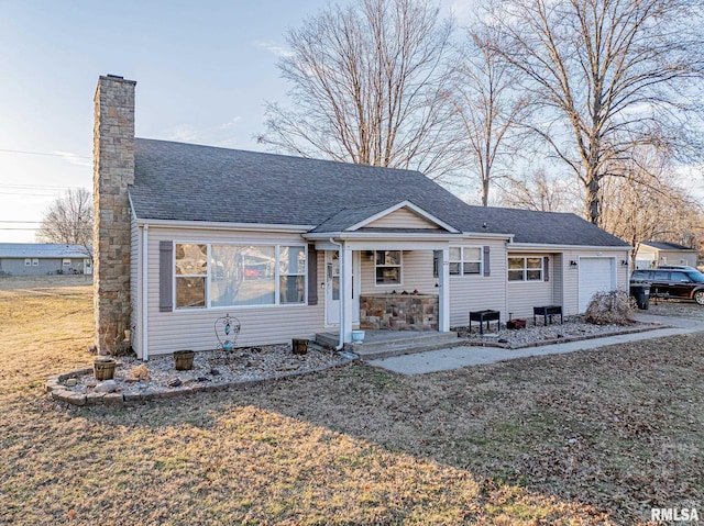 view of front of property with an attached garage, a chimney, a porch, and roof with shingles