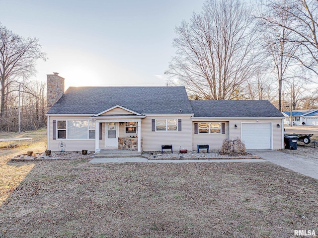 view of front facade featuring a garage, concrete driveway, a shingled roof, and a chimney