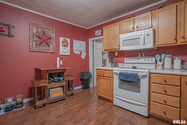 kitchen featuring white appliances, baseboards, light countertops, ornamental molding, and dark wood-style floors