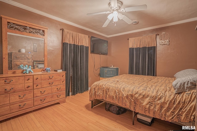 bedroom featuring ornamental molding, a textured wall, ceiling fan, and light wood finished floors