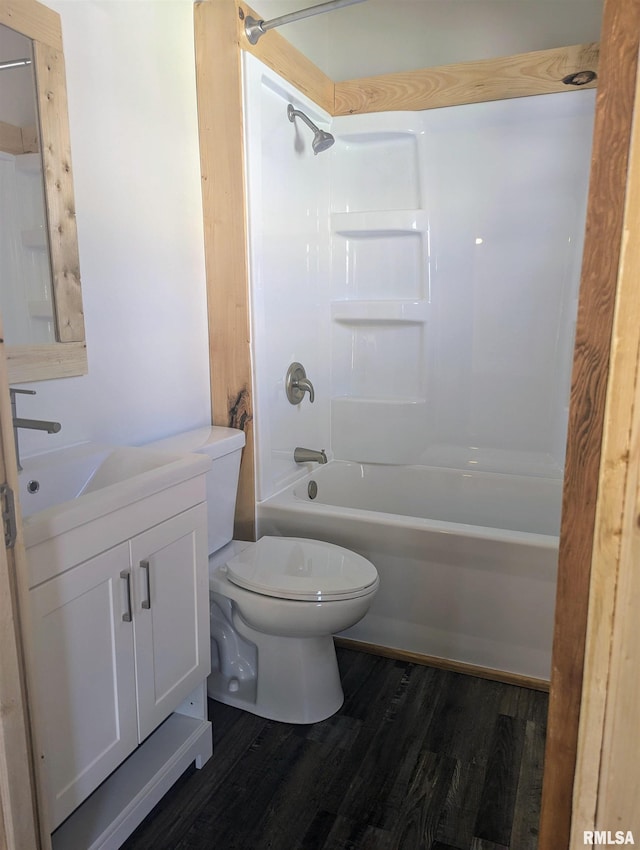 bathroom with shower / tub combination, vanity, toilet, and wood finished floors