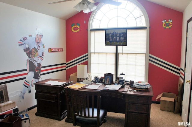 home office with vaulted ceiling, ceiling fan, and light colored carpet