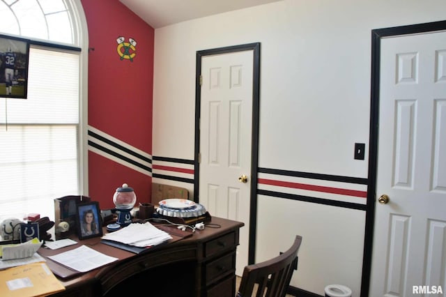 home office with lofted ceiling