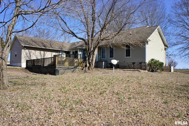 view of front of house with crawl space and a deck