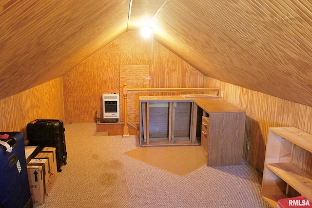 additional living space featuring lofted ceiling, wooden walls, carpet flooring, and heating unit