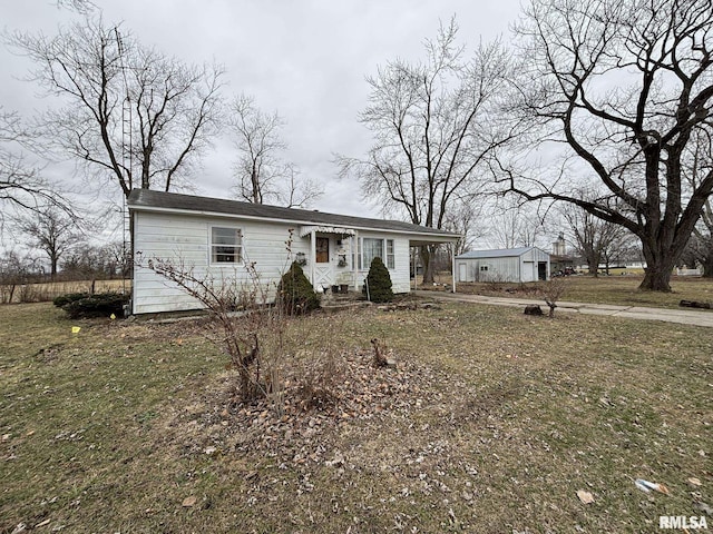 view of front of home featuring an outbuilding