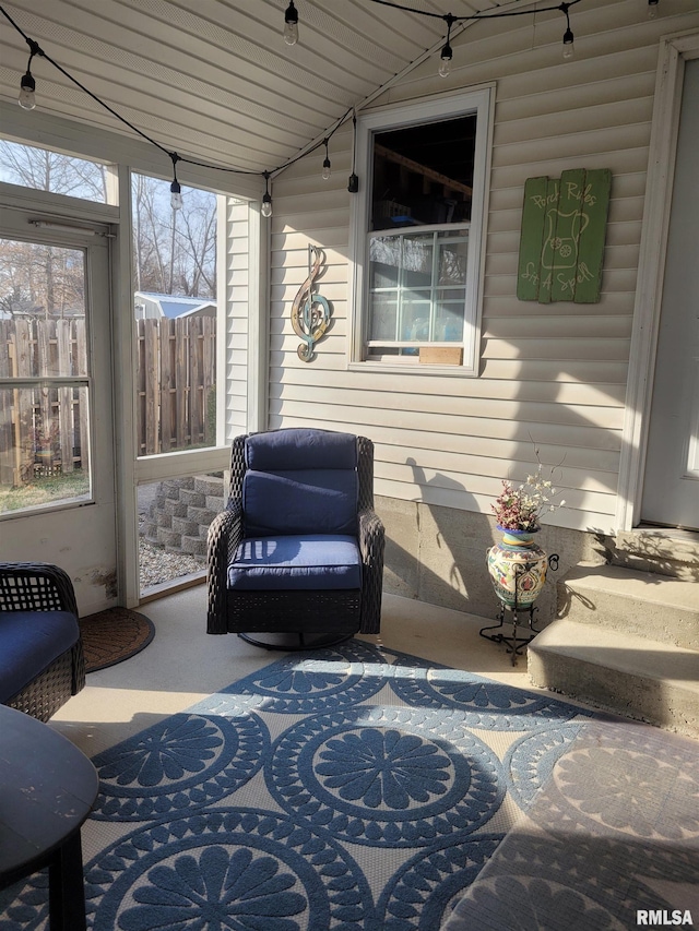 sunroom / solarium featuring lofted ceiling and wooden ceiling