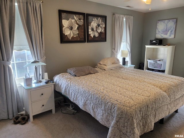 bedroom with carpet and visible vents