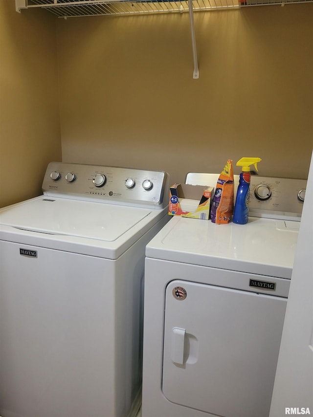 laundry area with laundry area and independent washer and dryer