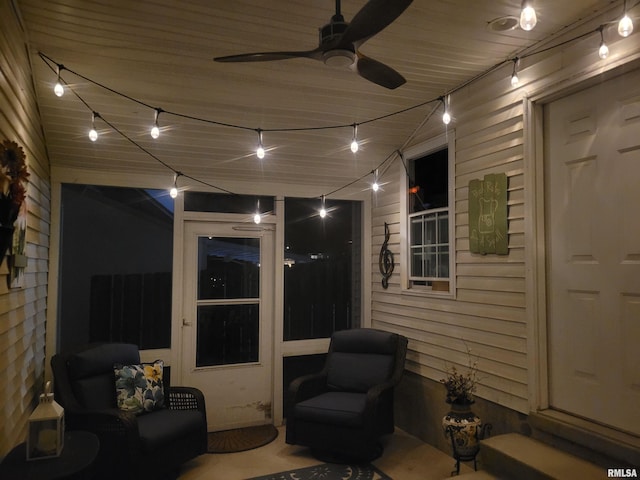 patio at twilight featuring ceiling fan