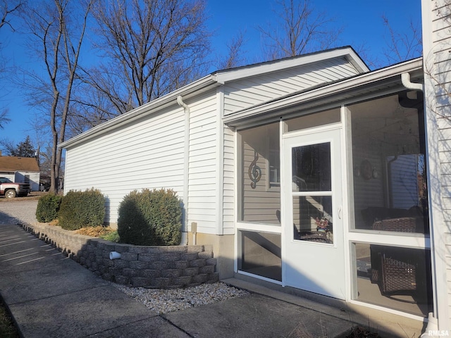 view of home's exterior featuring a sunroom