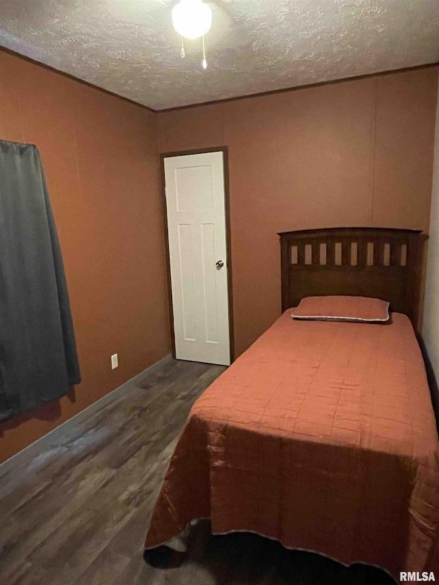 24555 Rock Springs Hollow Rd, Thebes, IL 62990 - bedroom featuring wood finished floors and a textured ceiling
