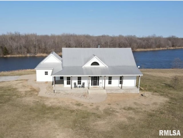 view of front facade featuring covered porch and a water view