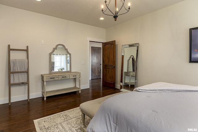 bedroom featuring a notable chandelier, baseboards, wood finished floors, and recessed lighting