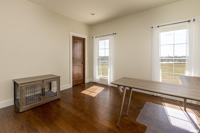 unfurnished office with hardwood / wood-style floors, recessed lighting, visible vents, and baseboards