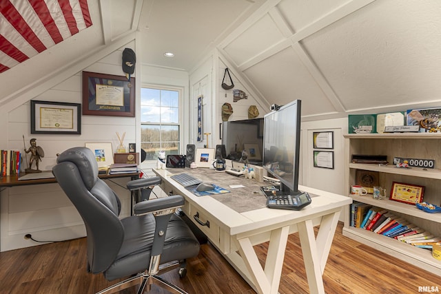 office space with lofted ceiling and dark wood-style floors