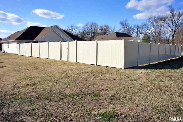 view of yard with a fenced backyard