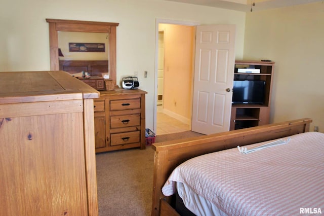 bedroom featuring light carpet