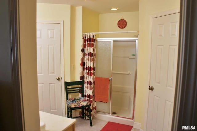 full bath featuring a shower stall and vanity