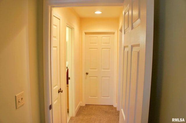 corridor featuring light carpet and recessed lighting