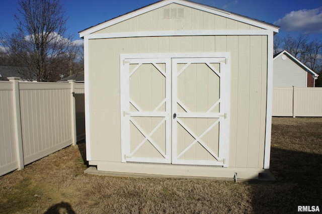 view of shed with fence