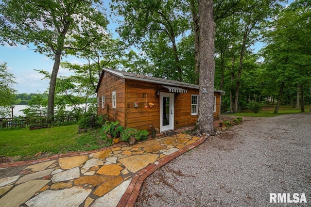 view of outbuilding with fence