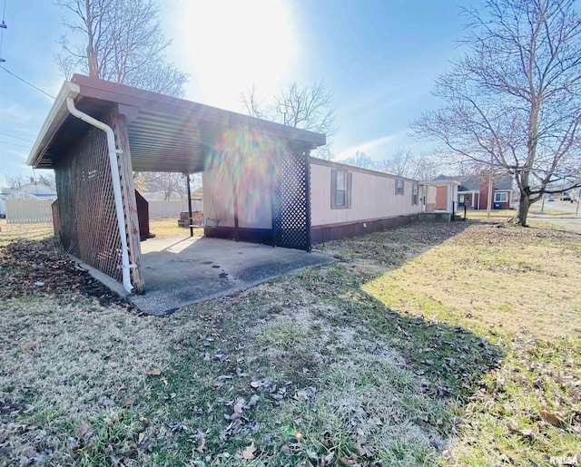 view of side of property featuring a patio area