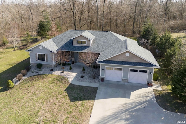 view of front of property featuring a front lawn, stone siding, concrete driveway, an attached garage, and a shingled roof