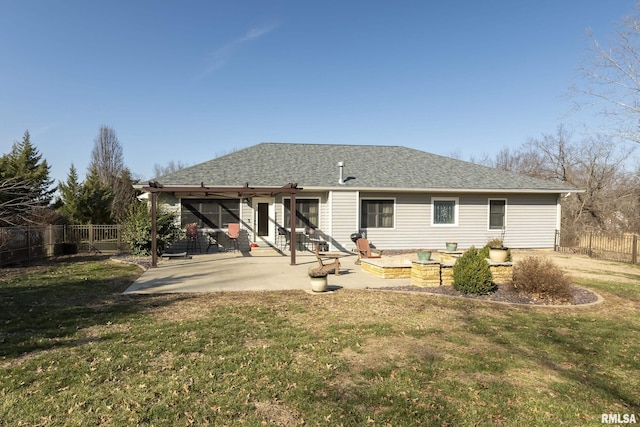 back of property featuring a patio area, a lawn, a fenced backyard, and a shingled roof