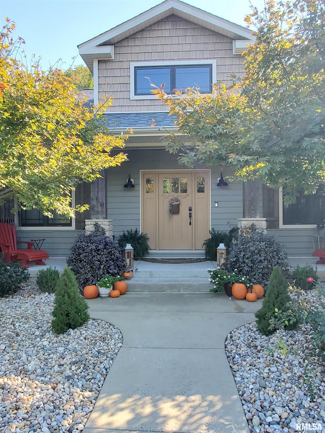 doorway to property with a porch