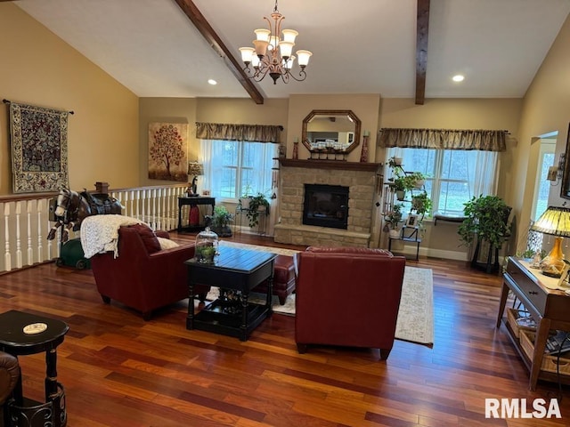 living room featuring wood finished floors, baseboards, vaulted ceiling with beams, a stone fireplace, and a chandelier