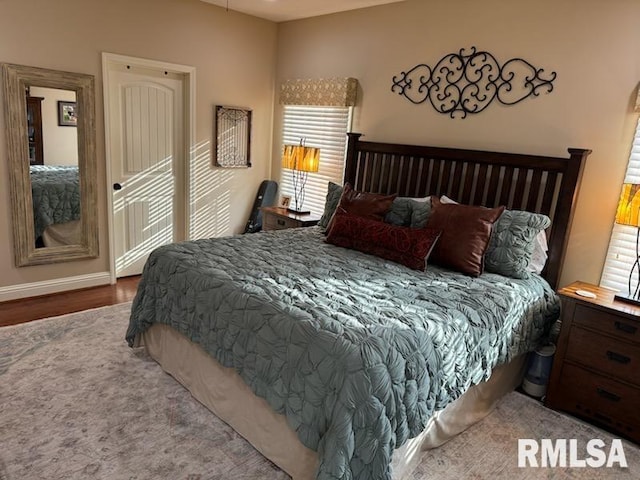 bedroom with wood finished floors