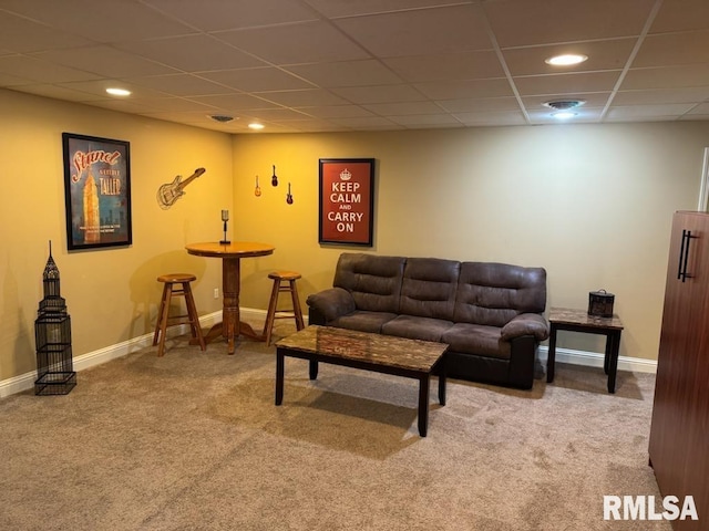 carpeted living area with recessed lighting, a drop ceiling, and baseboards