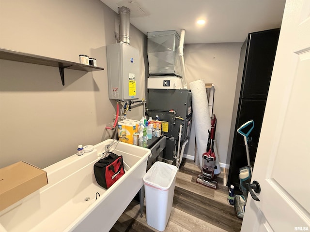 utility room with tankless water heater