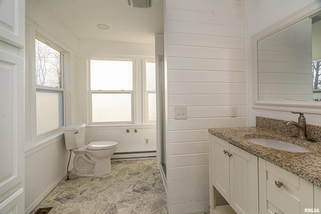 bathroom with toilet, a baseboard radiator, visible vents, and vanity