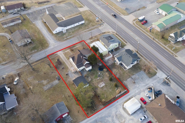 birds eye view of property with a residential view