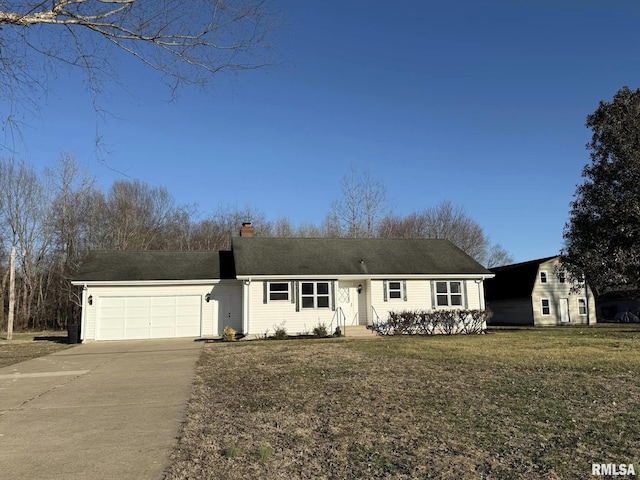 view of front of home featuring a garage, a chimney, a front lawn, and concrete driveway