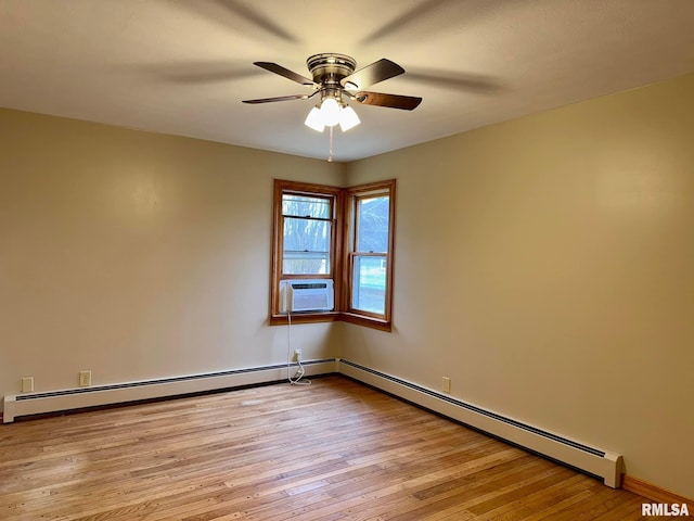 unfurnished room with a baseboard heating unit, cooling unit, and light wood-style flooring