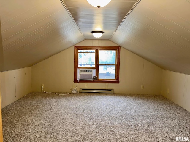 additional living space featuring lofted ceiling, carpet, a baseboard radiator, and cooling unit