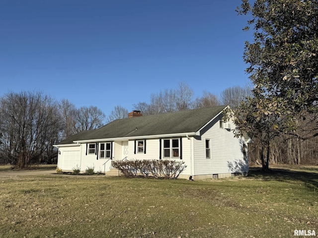 ranch-style house with a garage, a front yard, and a chimney