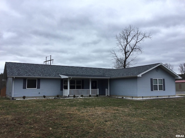 ranch-style home featuring a porch, a front yard, and a shingled roof